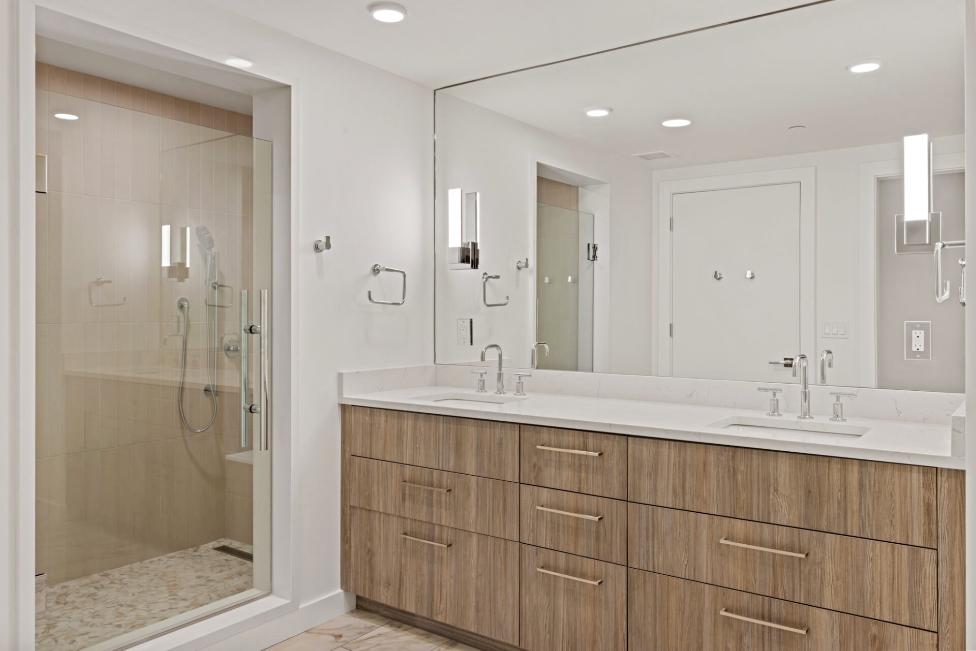 Finish Package A bathroom vanity with porcelain tile at The Henry Bozeman condos