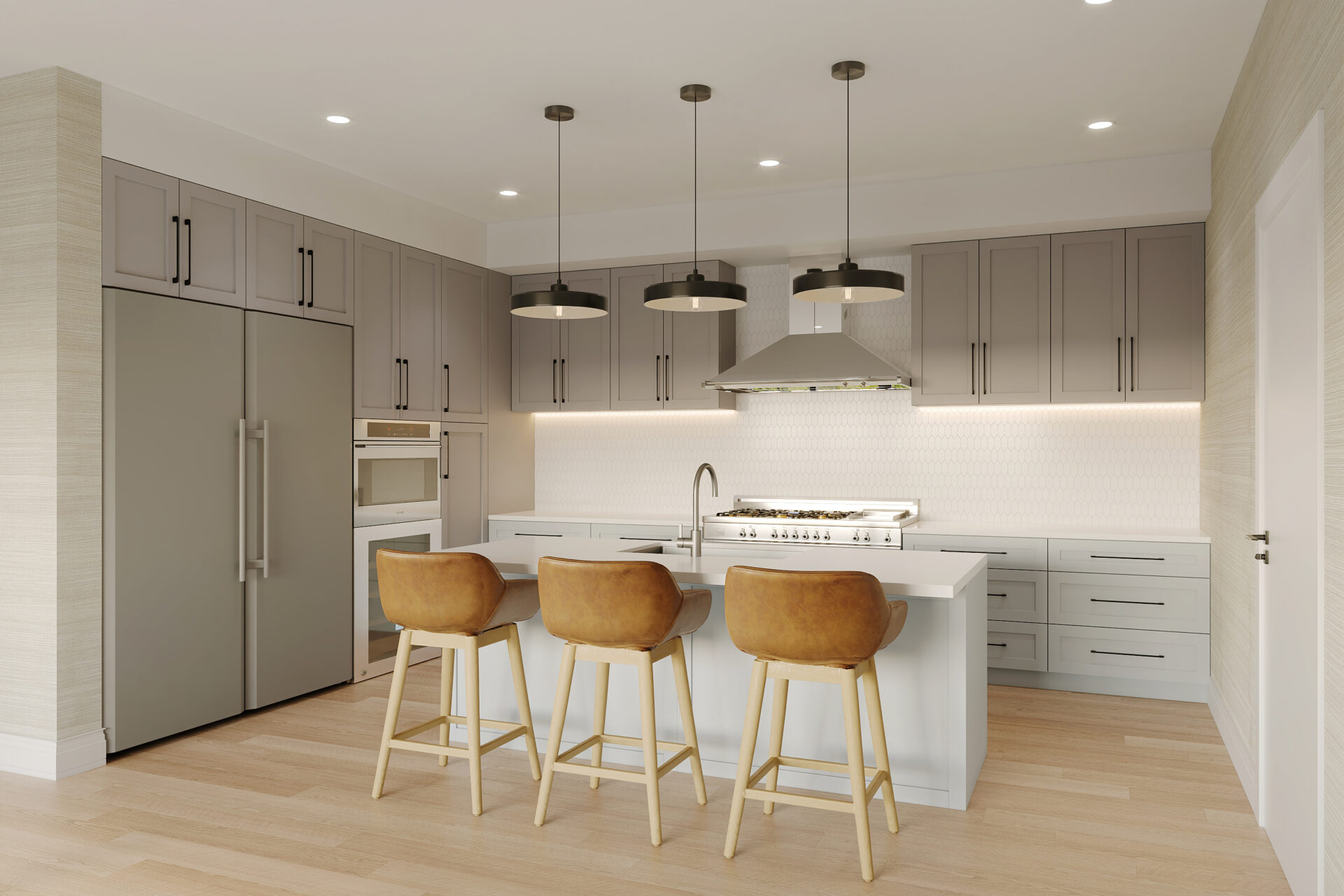 The Henry Bozeman penthouse gourmet kitchen with large center island, leather bar stools, gas range, and designer pendant lights