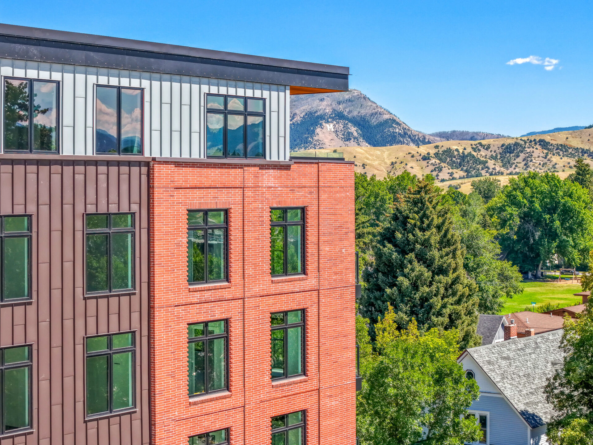 New luxury apartments in Bozeman MT at The Henry with stunning Bridger Mountains backdrop and downtown neighborhood setting